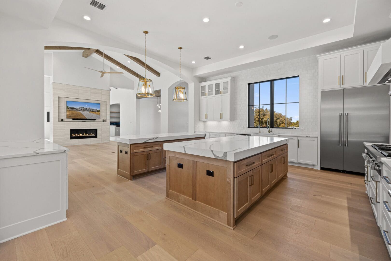 Spacious modern kitchen with a large island and elegant lighting.