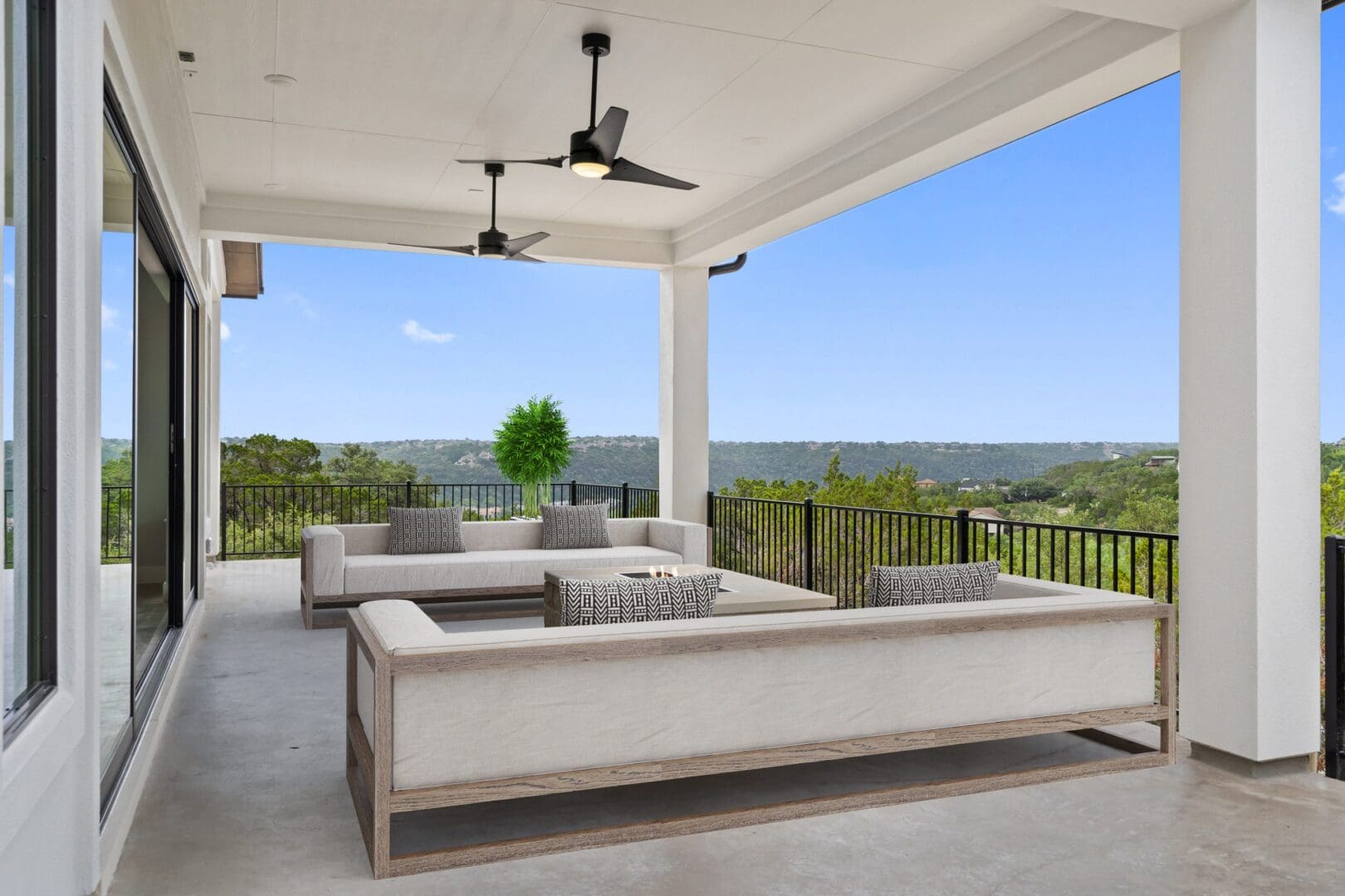 Spacious outdoor patio with modern seating and scenic views.